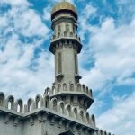 Minaret of a mosque in Bahrain against a cloudy sky