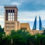 Traditional wind tower with the Bahrain World Trade Center behind